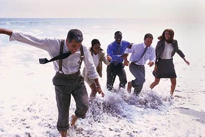 Businesspeople Playing in the Ocean